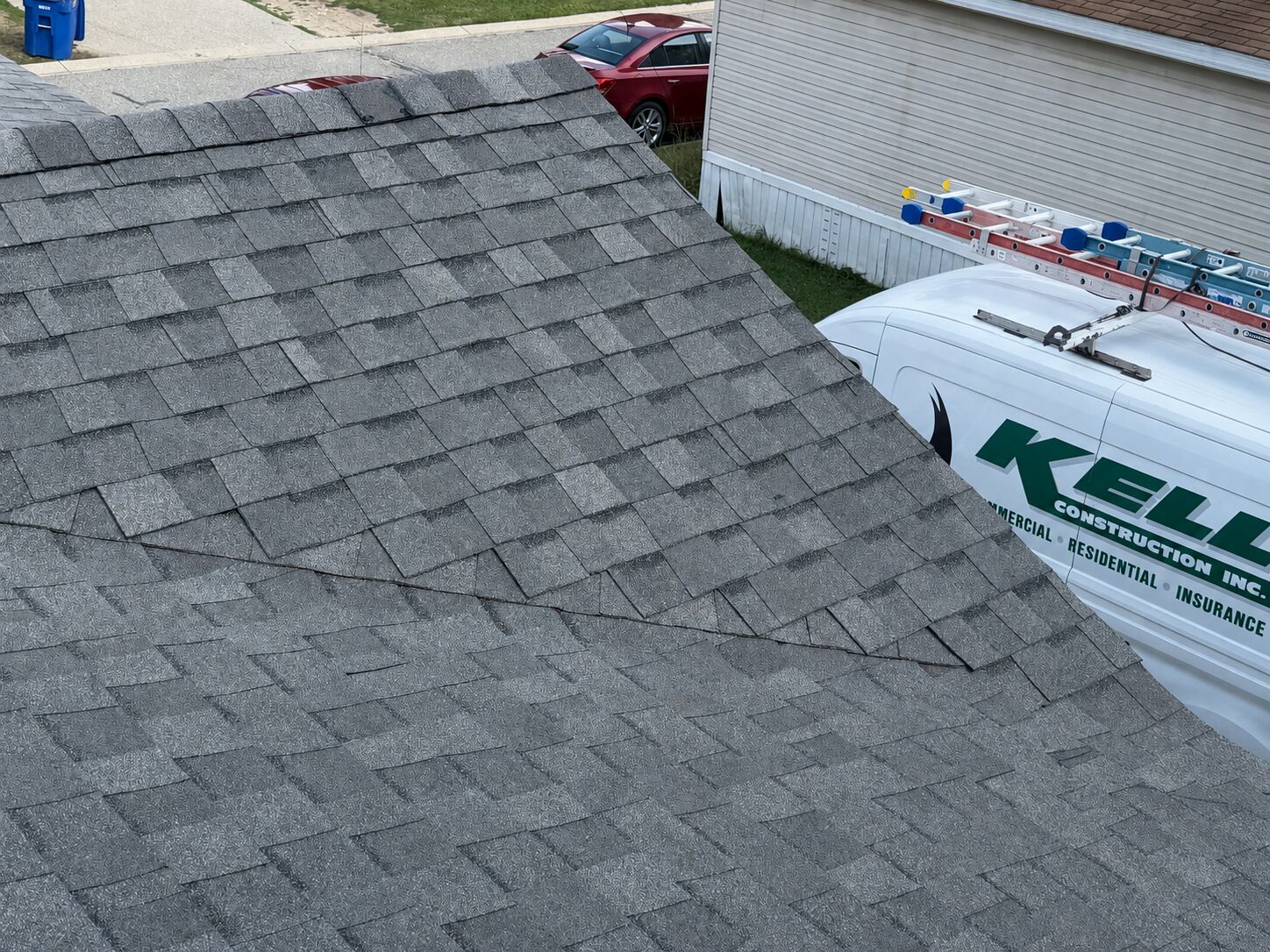 After: Wind-lifted and missing shingles replaced with new architectural shingle
